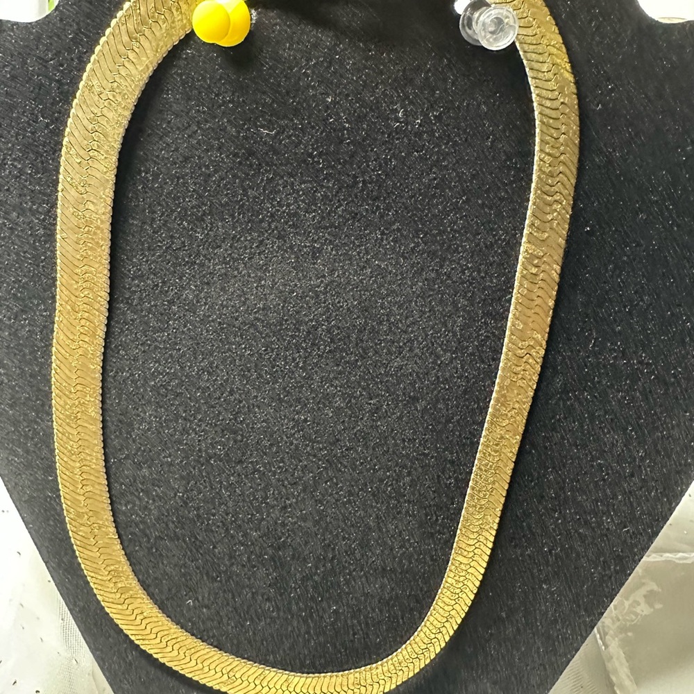 This is a vintage gold-tone herringbone chain necklace